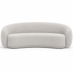 Modern curved bouclé sofa in cream fabric with rounded contemporary design isolated on white background.